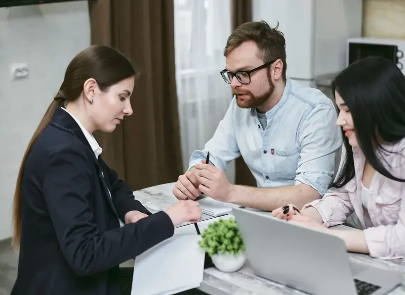Homeowners reviewing mortgage options with a lending specialist